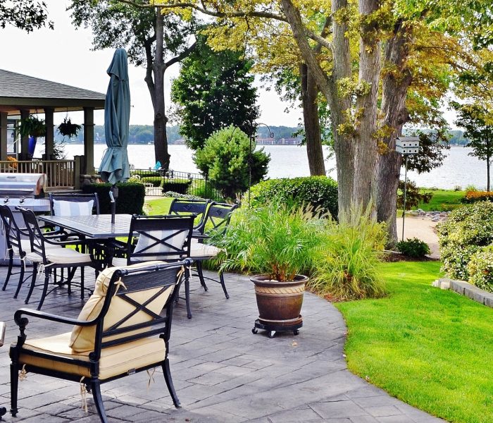 patio-outdoor-living-space-on-the-lake-with-beautiful-landscape-design.jpg